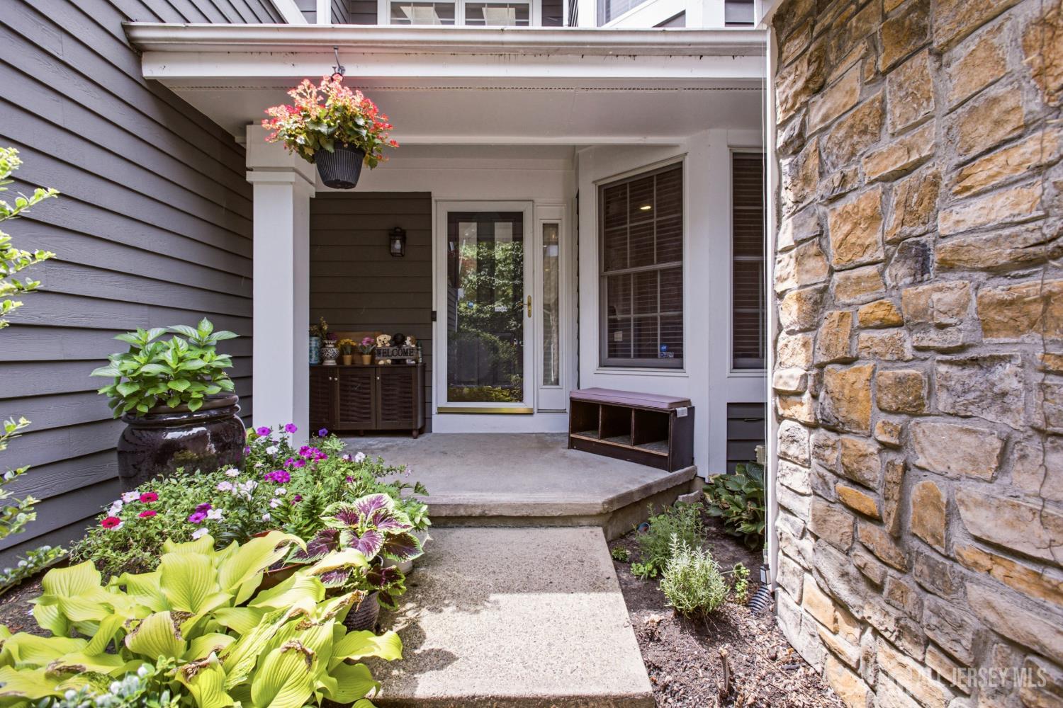 Welcome to this beautifully renovated 3-bedroom, 2.5-bath townhome in the highly desirable PrincetonWalk community, offering elegant living spaces, modern upgrades, and exceptional community amenities. A welcoming entry opens into a formal living room, creating the perfect space to greet guests or relax in style. The heart of the home is the beautifully updated kitchen, featuring granite countertops, abundant cabinetry, and a spacious pantry. The kitchen flows seamlessly into the combined family room and dining area, creating an open and inviting space ideal for everyday living and entertaining. Sliding glass doors lead to a private deck, extending your living space outdoors. The second level features two generously sized bedrooms including a spacious primary suite with its own private bath. The finished walkout basement offers incredible flexibility with a third bedroom and additional living space that is perfect for a recreation room, media room, home office, or guest suite, with direct access to the backyard. Additional features include gleaming hardwood floors, a one-car attached garage, updated finishes throughout, and ample storage. Enjoy a resort-style lifestyle with PrincetonWalk's outstanding amenities, including an indoor and outdoor swimming pool, tennis courts, clubhouse, and playground. Conveniently located near Route 1, Princeton Junction train station, major commuter routes, shopping, dining, and downtown Princeton, this home offers the perfect combination of luxury, convenience, and location. Don't miss this move-in-ready home in one of the area's most sought-after communities!