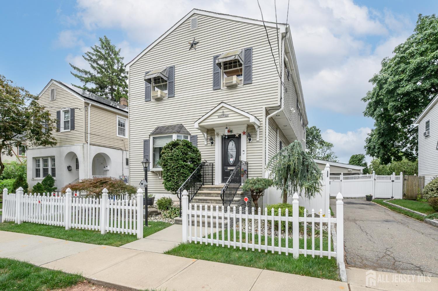 Welcome home to this beautifully maintained 3 Bedroom, 2.5 Bath Colonial in the heart of Woodbridge! A welcoming foyer entry opens to a bright and inviting interior featuring hardwood floors, vaulted ceilings, crown molding, and recessed lighting throughout. The spacious living room offers a charming bay window and custom built-ins, while the stylish powder room adds convenience for guests. The gourmet eat-in kitchen is designed to impress, boasting stainless steel appliances, including a custom built-in Sub Zero refrigerator and freezer, double oven, 11ft center island with sink & seating, abundant cabinetry, ceramic tile flooring and backsplash, and a dinette area. The expansive great room is the perfect gathering space, featuring an open-concept layout designed for both everyday living and effortless entertaining. This impressive space features a stylish dry bar, generous sitting area, and spacious dining area, all bathed in natural light from two sets of sliding glass doors. The seamless indoor-outdoor flow leads directly to the large Trex deck and covered patio, creating the perfect setting for hosting gatherings, summer barbecues, or simply relaxing while enjoying views of the private backyard. Upstairs, you'll find three generously sized bedrooms and a full main bath with a tub shower. The primary suite serves as a private retreat with 2 walk-in closets and an ensuite bath featuring a stall shower. A partial basement provides laundry facilities and ample storage space. Outside, enjoy your own private backyard oasis complete with a fully fenced yard, a large Trex deck surrounding the pool, an expansive covered patio, and plenty of outdoor lighting. 2 car detached garage currently being used for storage. A private driveway offers convenient off-street parking. Ideally located near shopping, dining, parks, schools, public transportation, and major roads, this home offers the perfect combination of comfort, convenience, and an unbeatable commuter-friendly location. Come & see!!