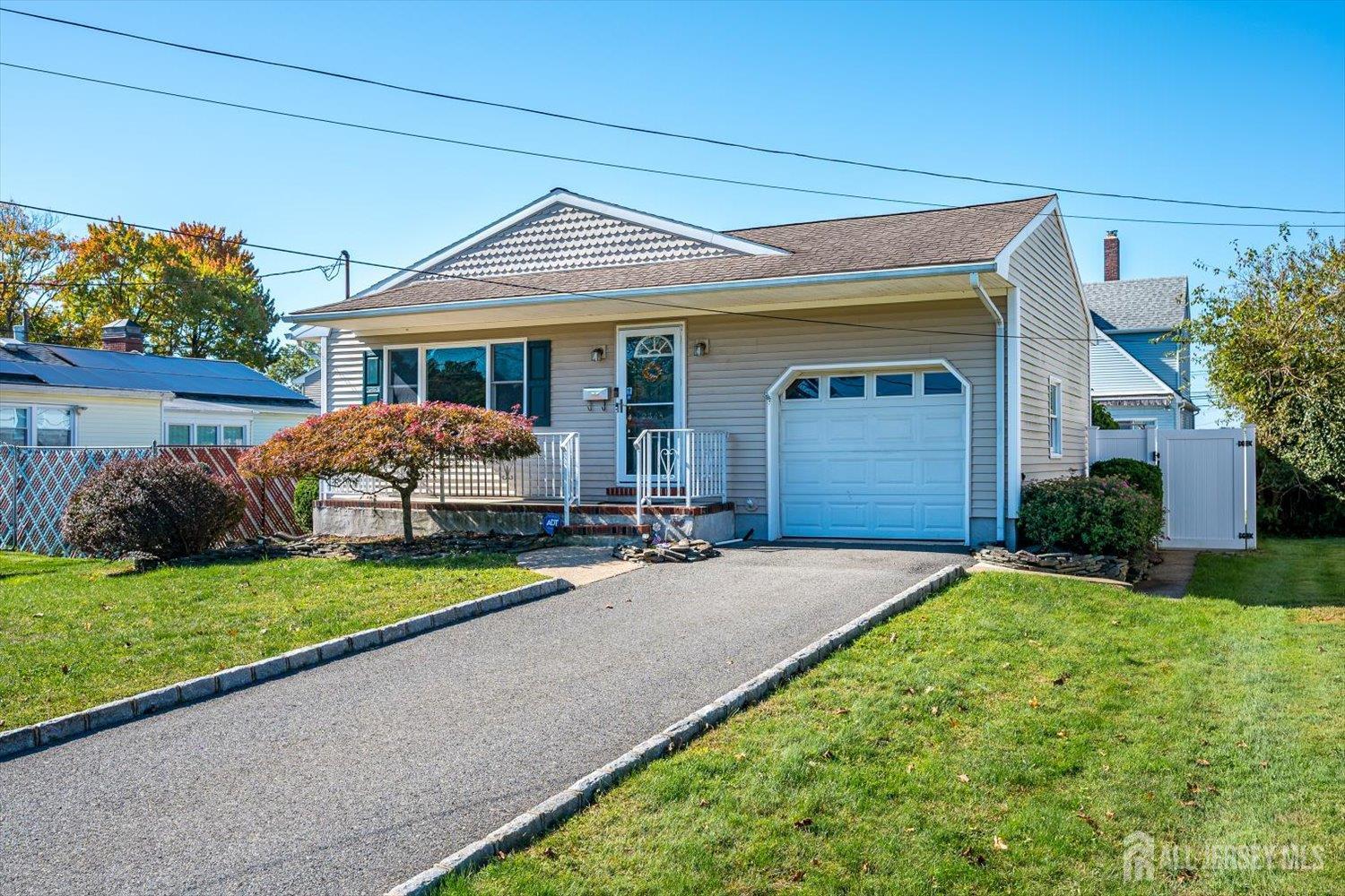 Excellent location on a quiet street in the Kennedy School area of South Plainfield, this 3-bedroom, 1.5-bath ranch home offers easy one floor living. Entry foyer opens to a nice size living room with fireplace and formal dining room. There are hardwood floors throughout the first level and new flooring in the eat in kitchen. Fabulous finished basement complete with  bath and a huge room for storage as well. The fully fenced yard offers a paver patio. Location is a standout, with Oak Park Commons shopping center, Putnam Park, the South Plainfield Community Pool, and the PAL complex nearby. Close to major highways, NYC trains (Metropark and Metuchen). Seller is including a one year AHS home warranty. Fireplace, chimney & flues "As Is' no known conditions.